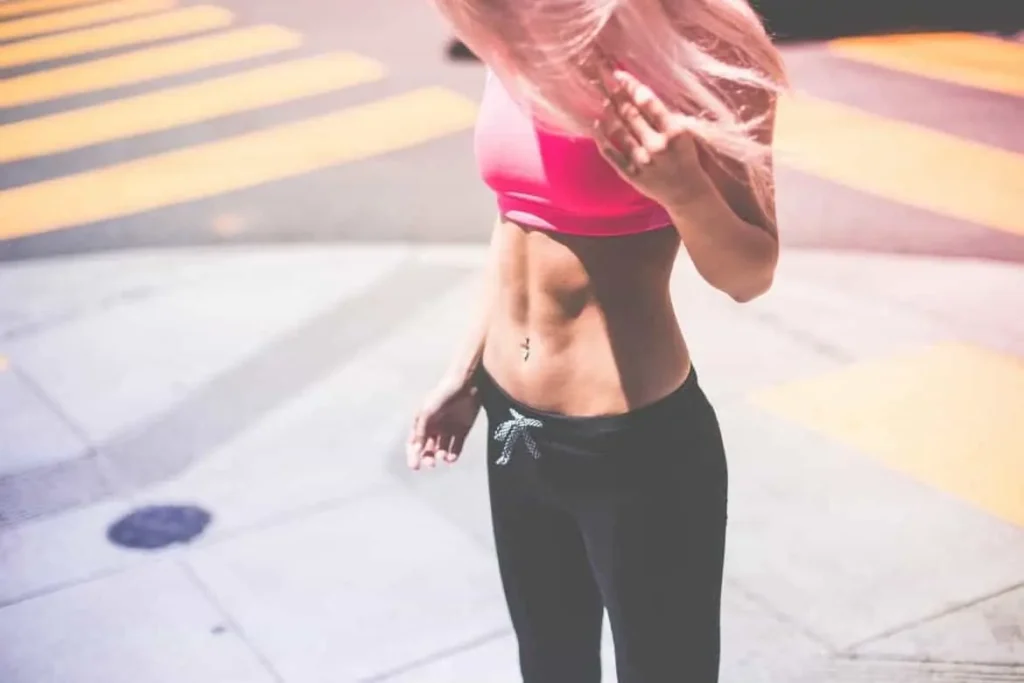 Woman with toned stomach after LA-EMS Body Sculpting Treatment Sunbury-on-Thames